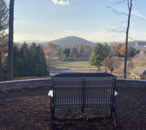 A bench looking out over the Shenandoah Valley mountains, to show what your lifestyle could look like at Glen at Cooks Creek